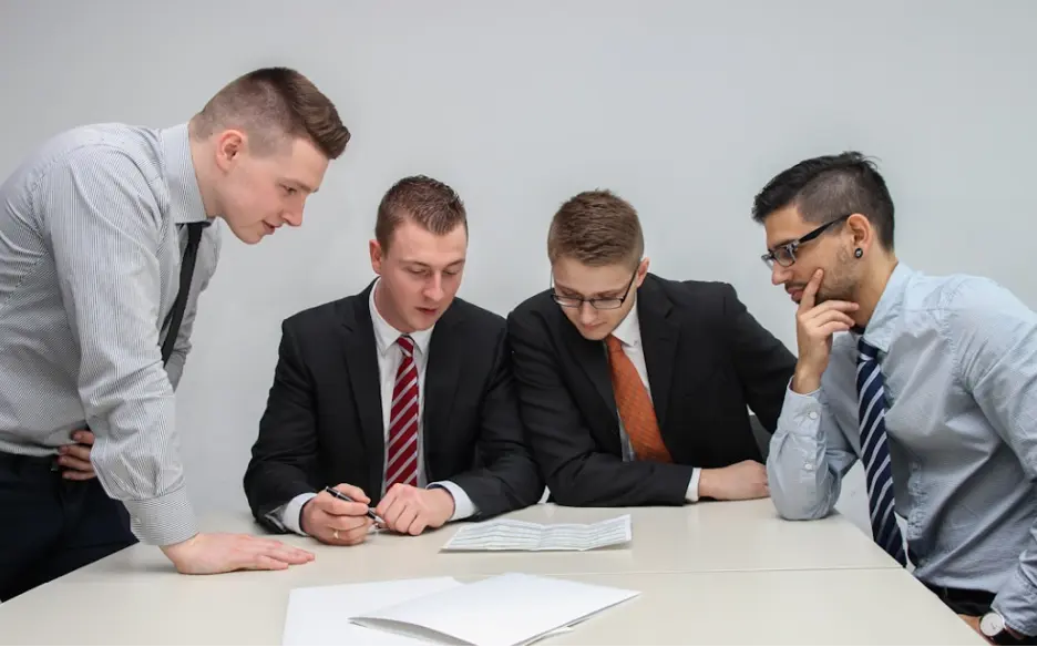 A group of people looking at the recent data on quality customer reference